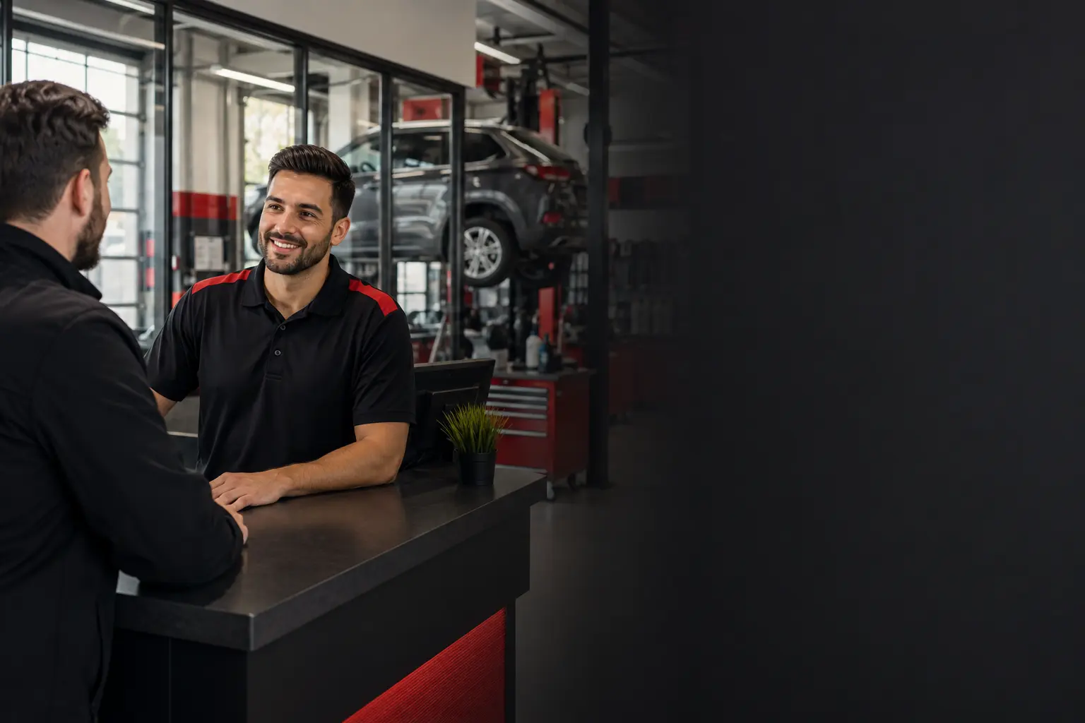 Service advisor helping a customer at Grip Tire and Auto